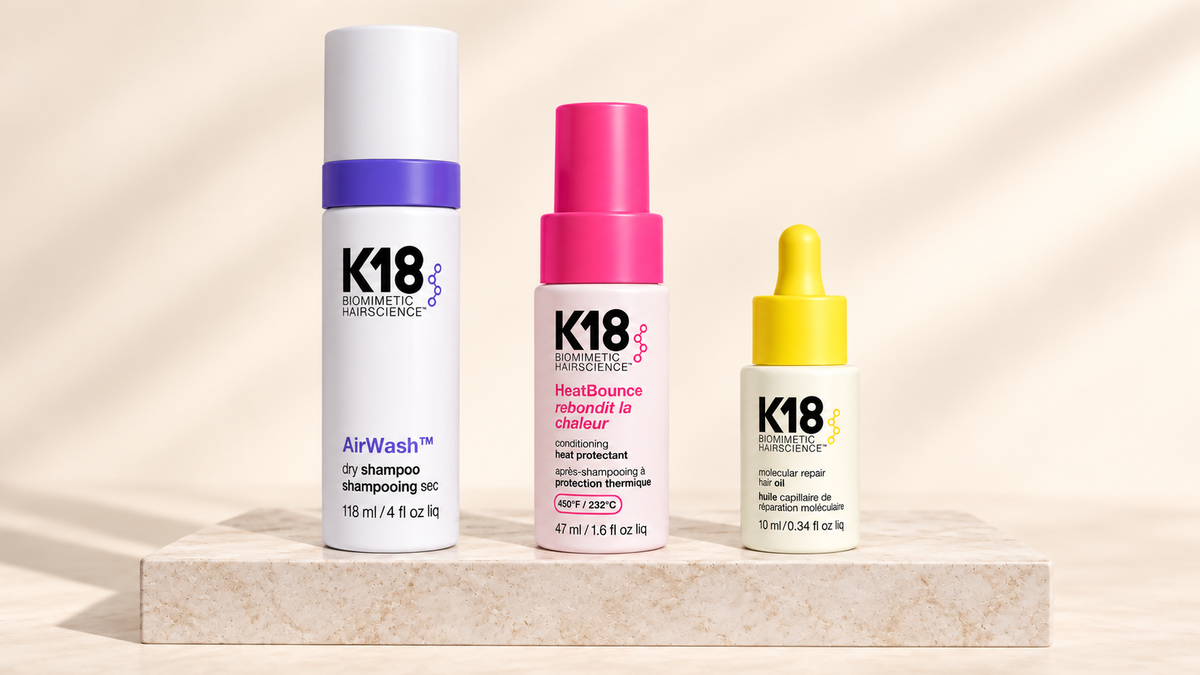 K18 AirWash, HeatBounce og Hair Oil på lys steinplate