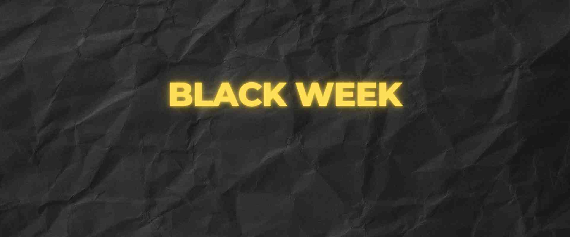 Black Week sale banner with yellow text on crumpled black background.